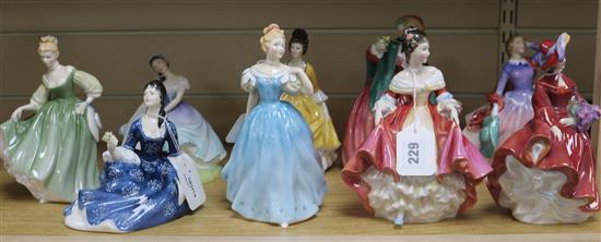 A collection of nine Royal Doulton figures,